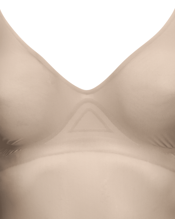 Bonding under and between the cups lifts and holds the bust. Support comes from placement, not wires.