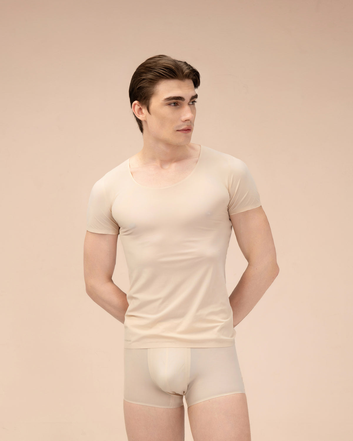 Dimitri is wearing size Medium in color Sand